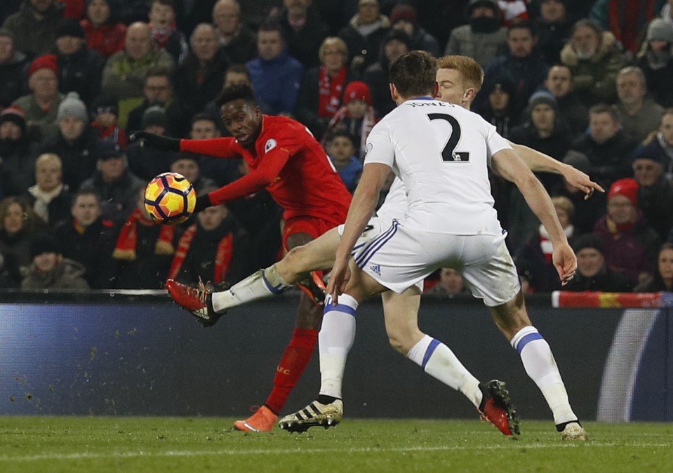  Divock Origi curls home his winning goal for Liverpool against Swansea