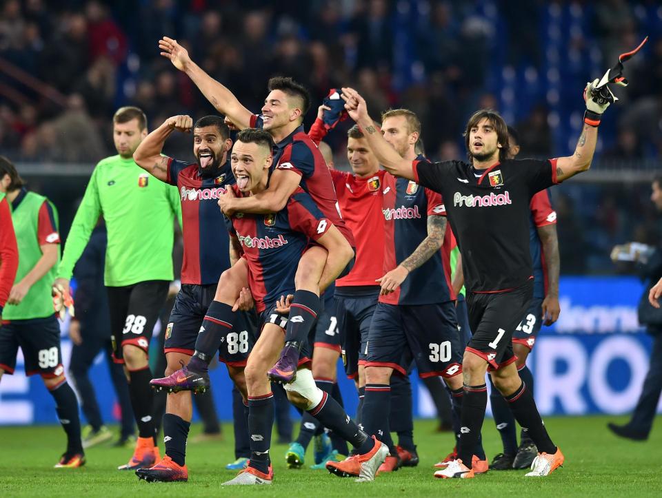  Genoa players celebrate after a famous win against Serie A leaders, Juventus