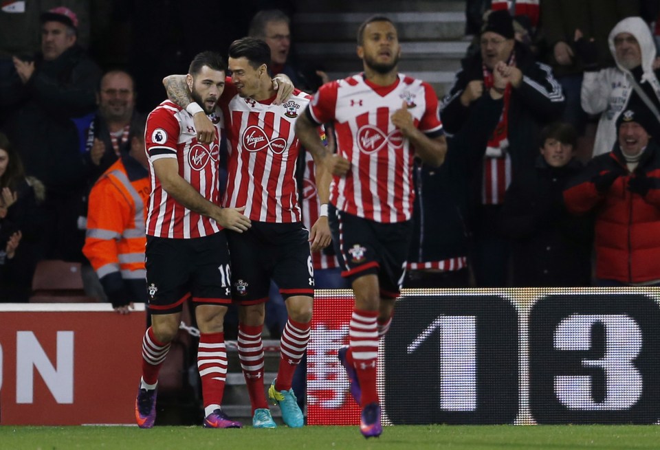  Southampton's Charlie Austin celebrates scoring their first goal with Jose Fonte