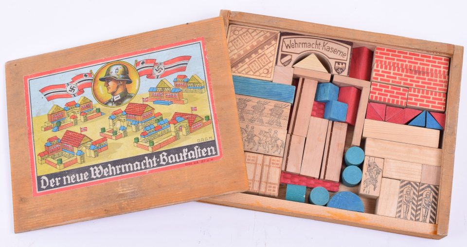  Blocks in sinister game are plastered with images of German soldiers and battle flags