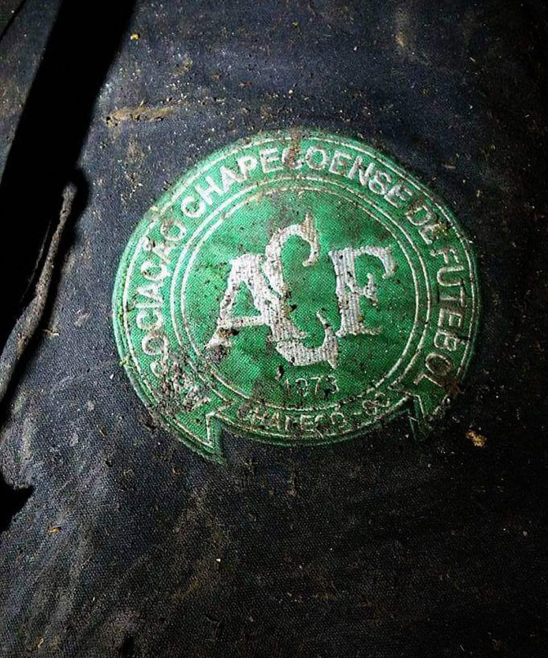 A logo of the Brazilian football team Chapecoense was seen at the crash site