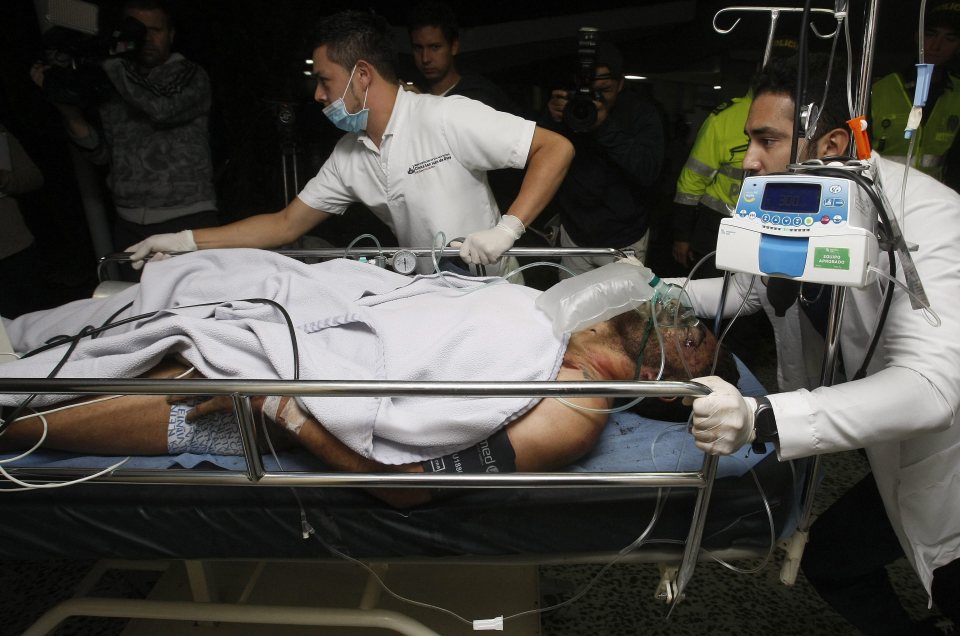 Medical staff from the San Juan de Dios hospital transfer 27-year-old Brazilian footballer Alan Ruschel