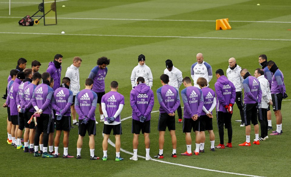 Real Madrid's players observe a minute's silence at training for the victims of the crash