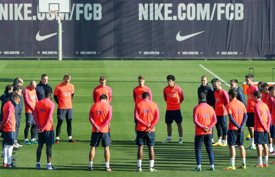 Barcelona's players observe a minute's silence at training for the victims of the crash