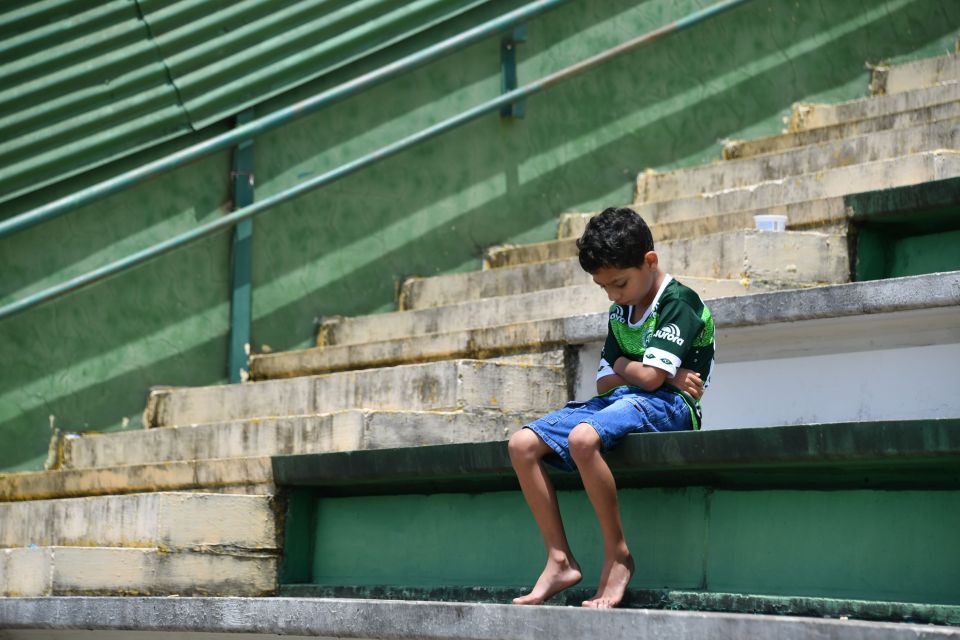 A boy sits alone to reflect on the tragic events