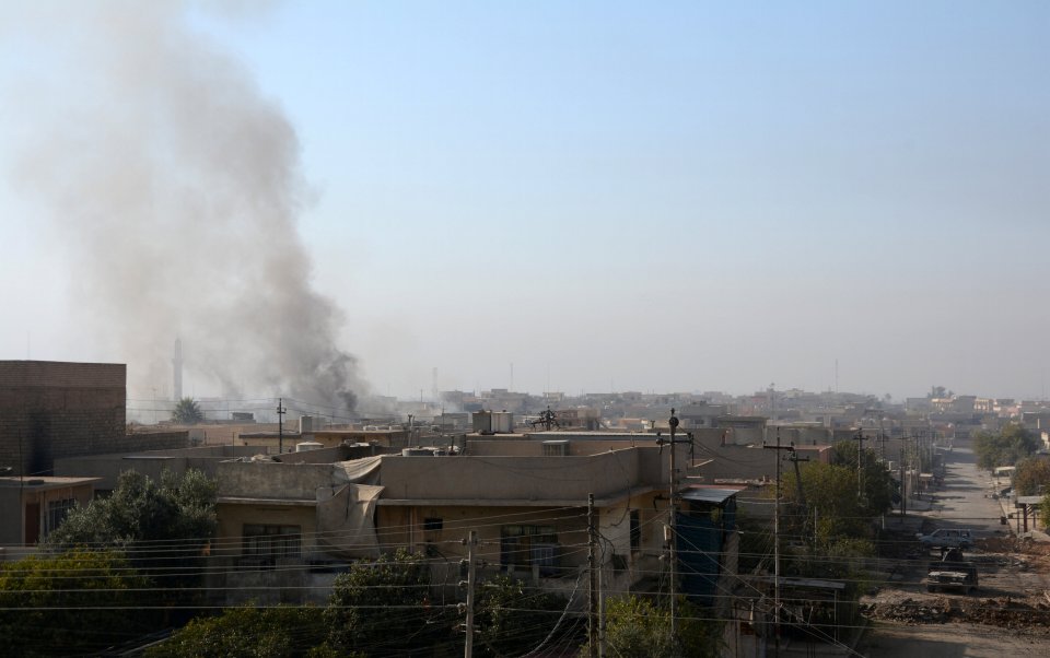  Smoke rises from clashes in Mosul during a battle with Isis