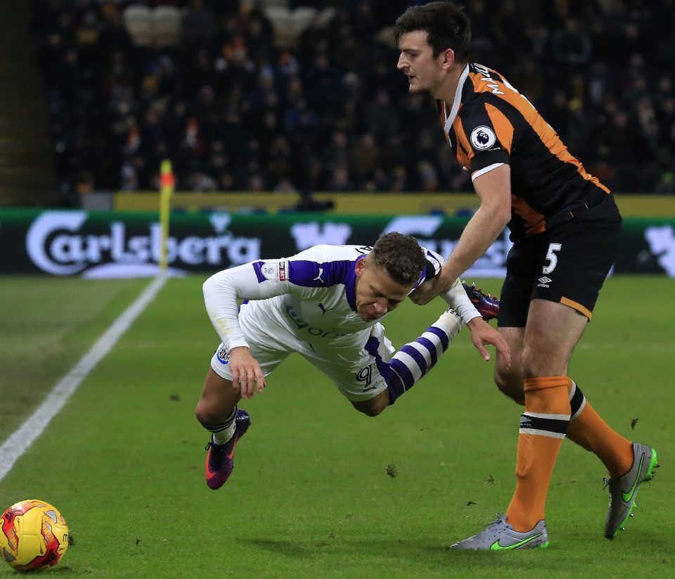 Maguire vies with Newcastle's Dwight Gayle