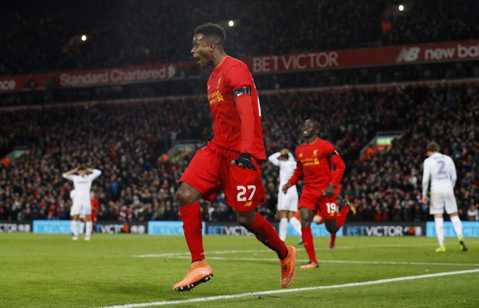 Divock Origi wheeled away in celebration after opening the scoring