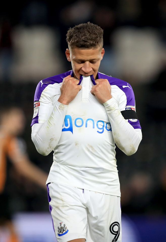 Newcastle striker Dwight Gayle is similarly upset after he he saw his spot-kick crash against the bar