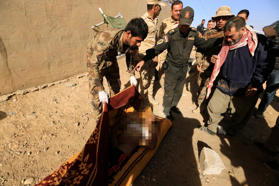  A man cries over his son killed by an ISIS sniper in the city