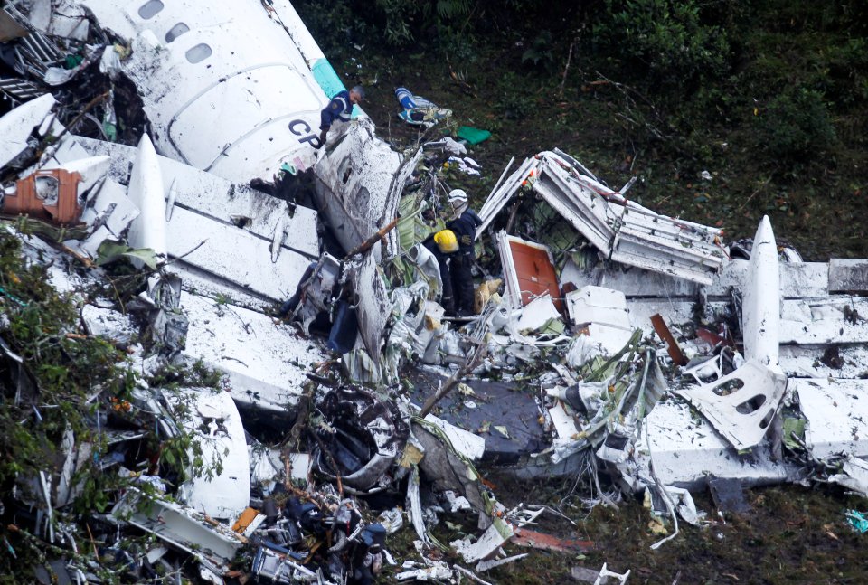 Rescue crews work at the wreckage around 30km south of Medllin