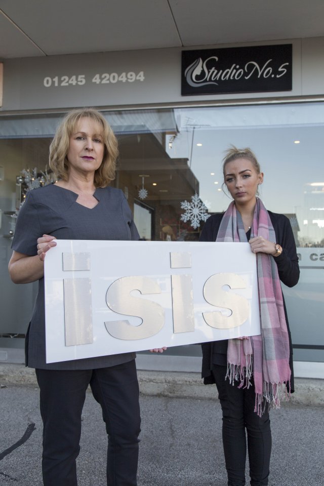  Owner Karen Lawrence and beauty therapist Lin Hoblin posing outside Studio No 5 with the old ISIS sign in Writtle, Essex