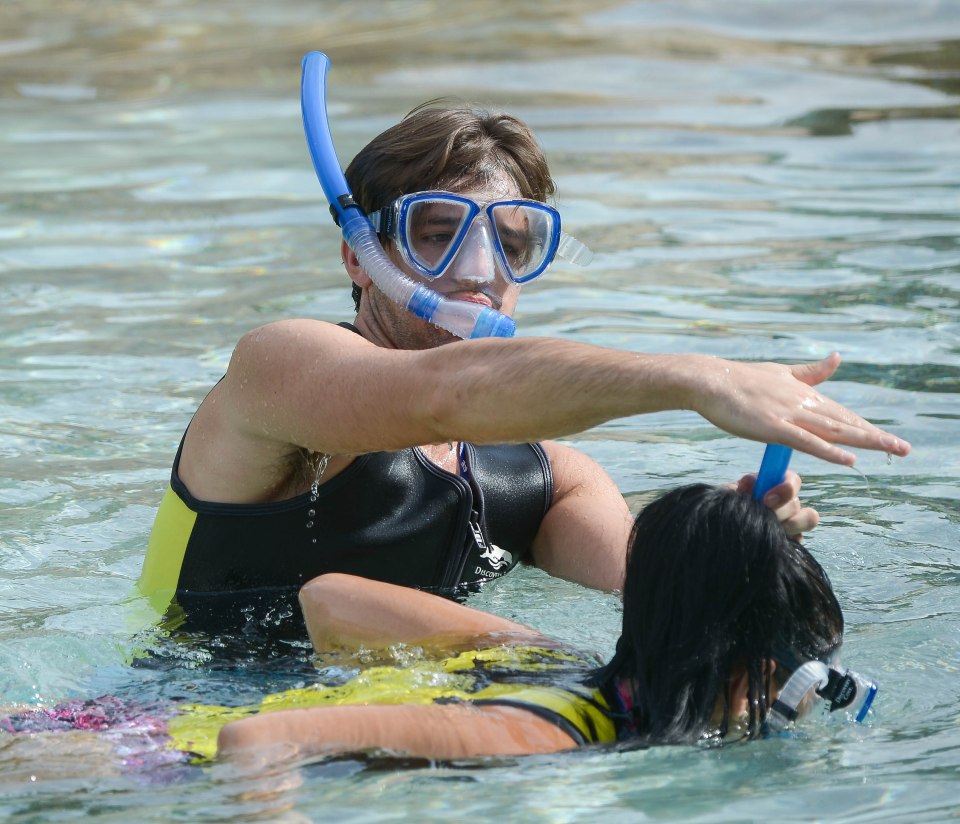 Nathan joked with his girlfriend by covering the tube on her snorkel