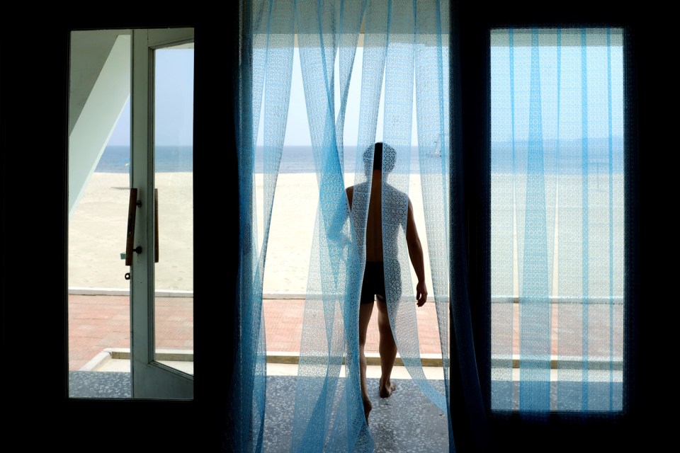  A man exits the changing rooms at a beach near Wonsan on North Korea's east coast