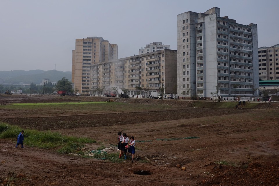  Schoolchildren on their way home in provincial Pyongsong, known as the 'City of Scientists'