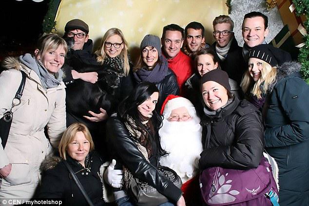  Employees at My Hotel Shop visit Santa at a Christmas market