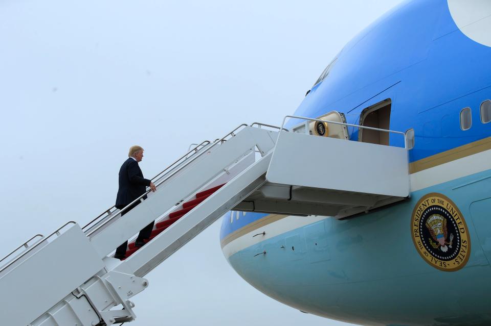 President Donald Trump boards Air Force One for a trip to Las Vegas