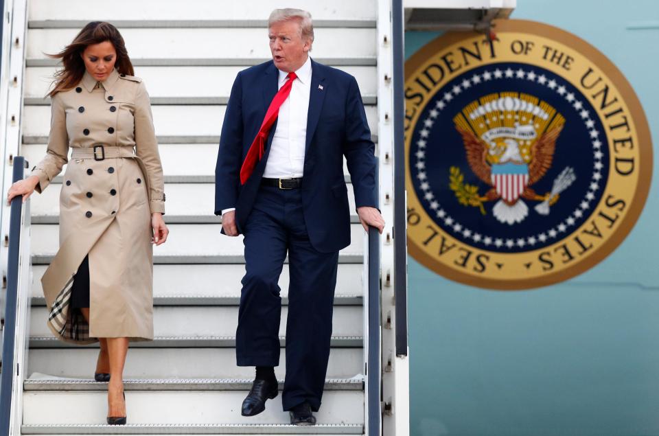 US President Donald Trump and first lady Melania Trump arrive aboard Air Force One ahead of the NATO Summit