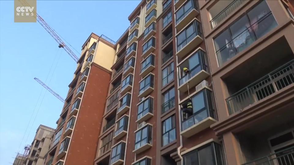  After several heart-stopping seconds he manages to pull her through the open window