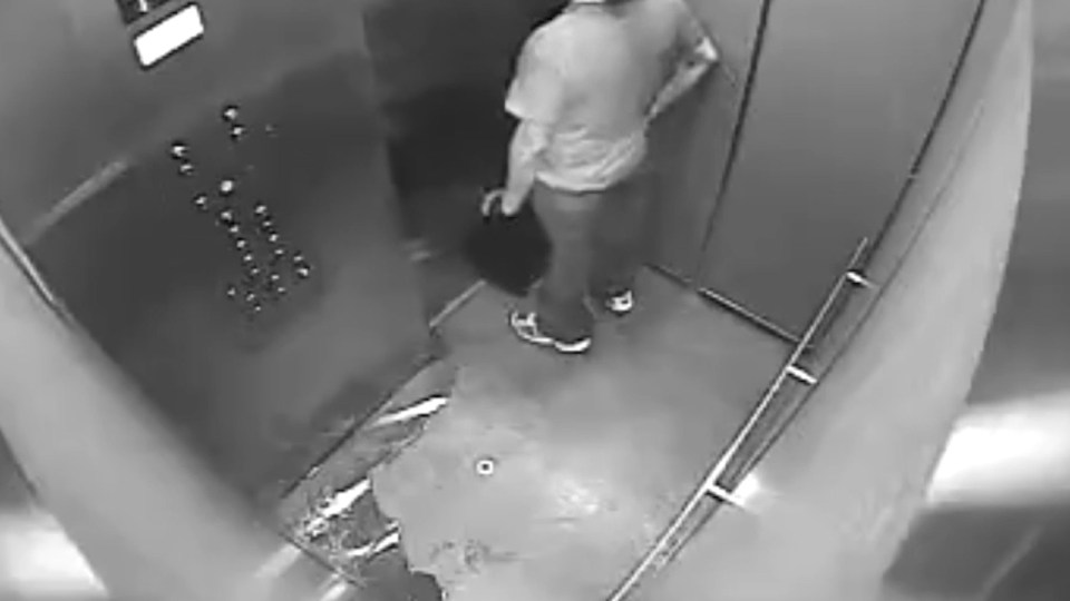  The man waits impatiently to get out of the lift, but nobody walks in past him to discover his dirty deed