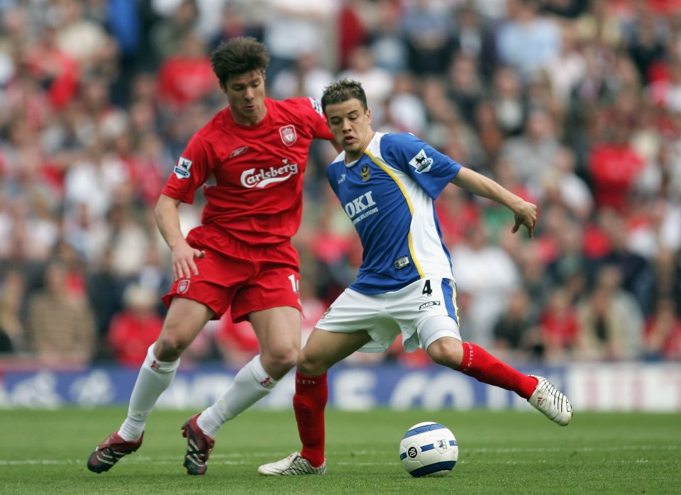 PORTSMOUTH, UNITED KINGDOM - MAY 07: Andres D'Alessandro of Portsmouth is challenged by Xabi Alonso of Liverpool during the Barclays Premiership match between Portsmouth and Liverpool at Fratton Park on May 7, 2006 in Portsmouth, England. (Photo by Richard Heathcote/Getty Images)