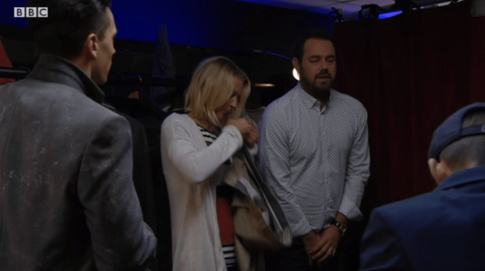  Mick Carter covers up with his hands as Kathy helps sew up his trousers