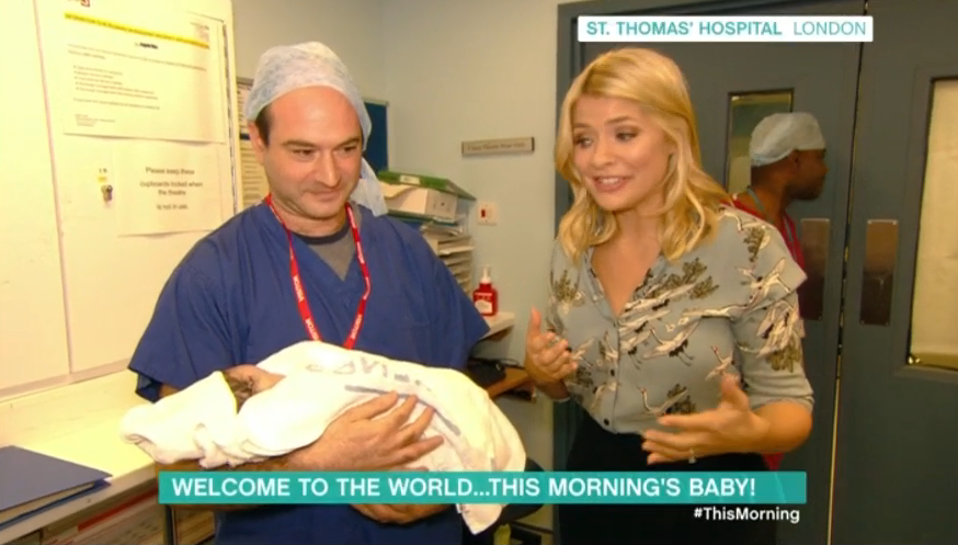  Holly gets emotional at St Thomas' hospital with baby May and her delighted dad