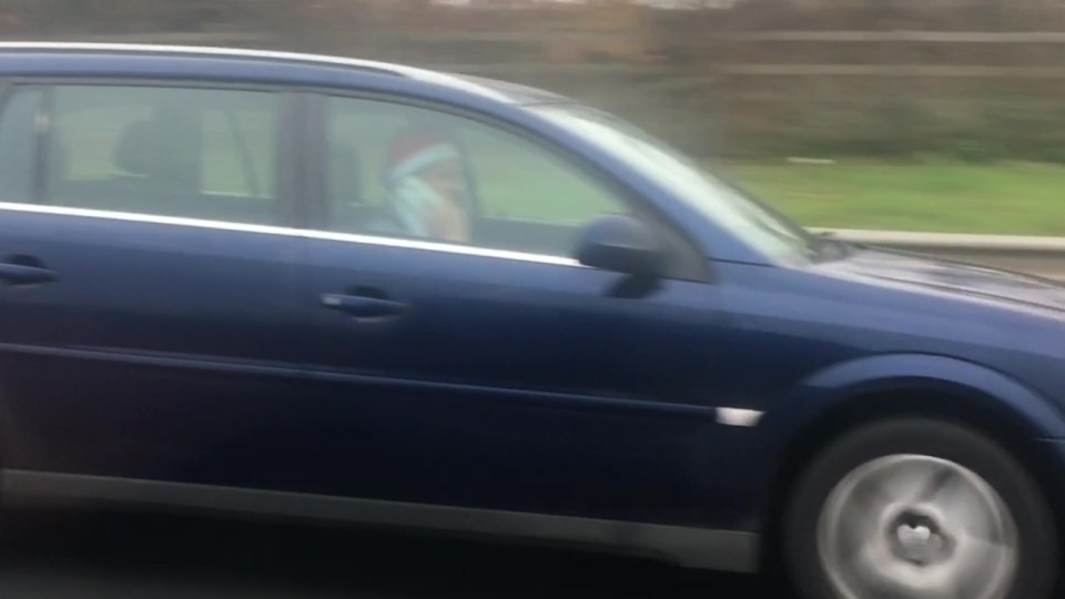 Keeping his head warm with a Santa hat, the driver was accused of not being 'spatially aware' while on the M4 near Heathrow