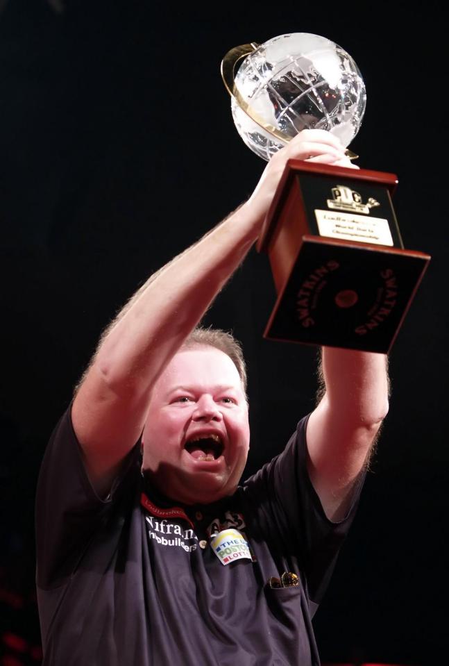  Raymond van Barneveld held the PDC World Championship trophy over his head after beating Phil Taylor