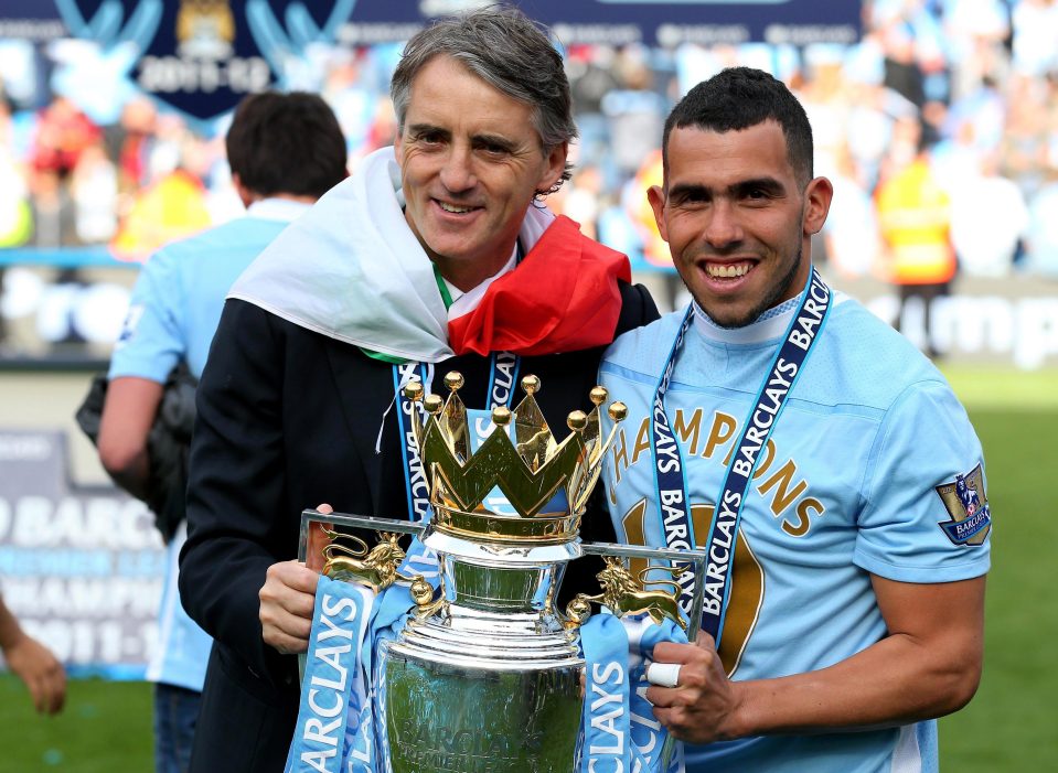 Carlos Tevez cut a much happier figure when he won the Premier League with City