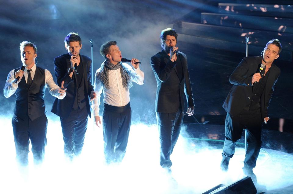  Gary Barlow, Howard Donald, Jason Orange, Mark Owen and Robbie Williams perform as Take That in 2011