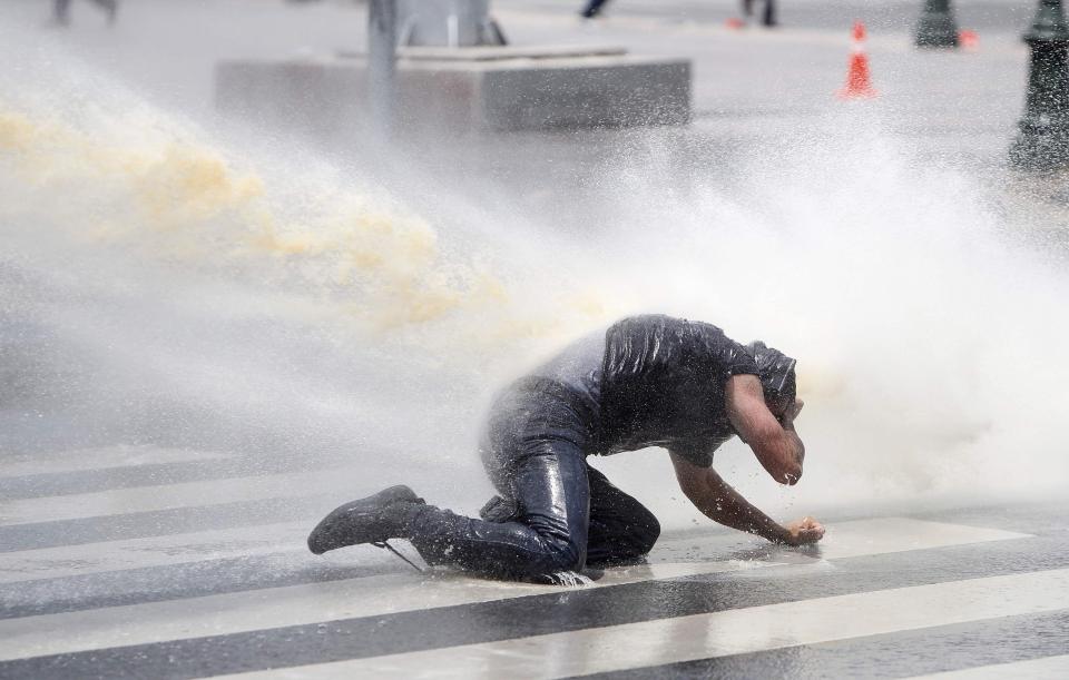  A protester is sprayed by water cannon during a demonstration in Turkey