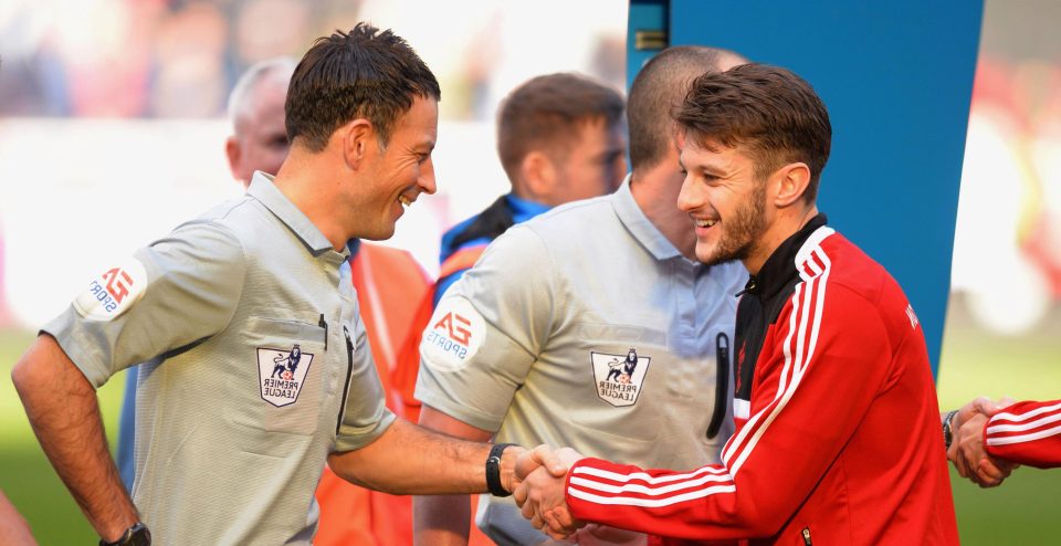 Clattenburg with Adam Lallana in 2014