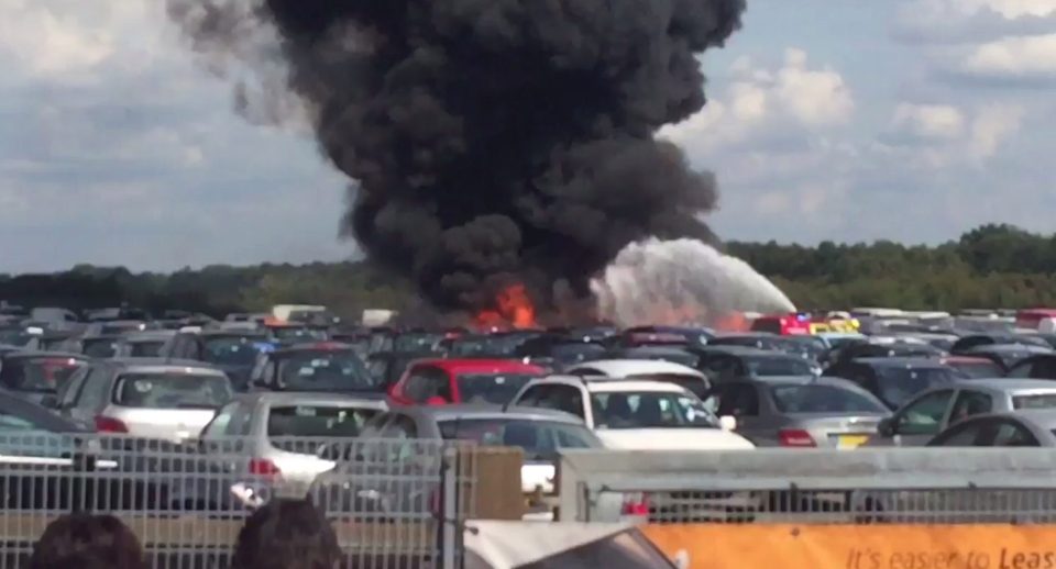  Fire and thick smoke rises from the site of the disaster