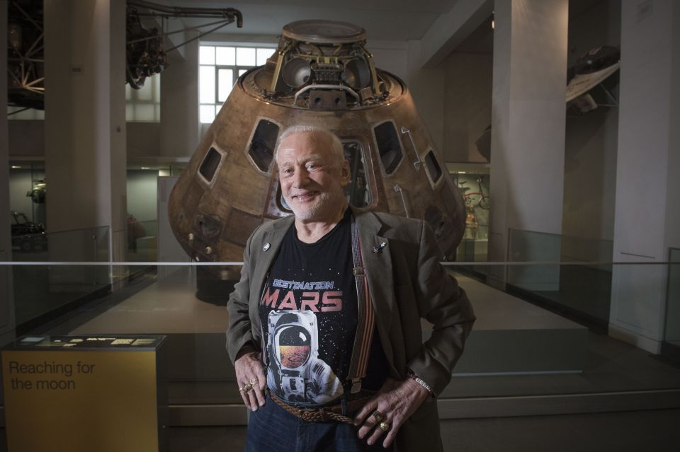 Buzz poses beside the real Apollo 10 command module at the Science Museum, London