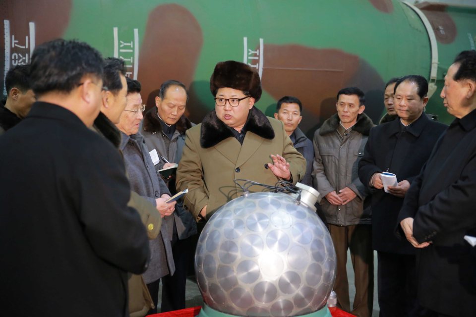  He loves it ...Kim exchanges nuke banter with scientists and technicians involved in research of nuclear weapons, at an undisclosed location