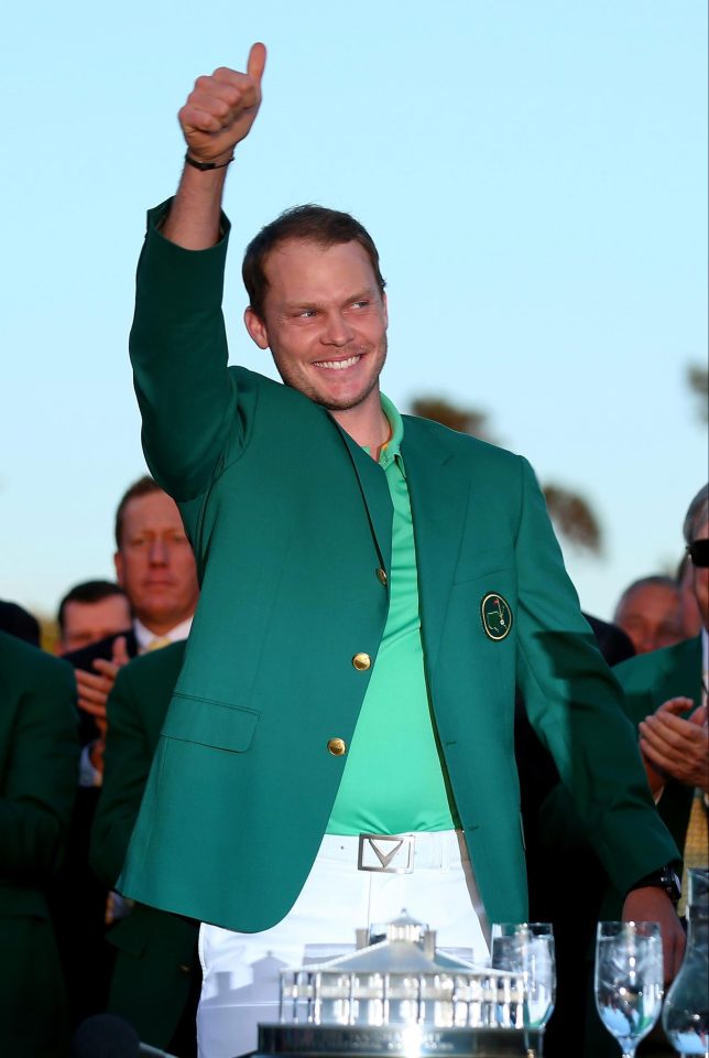 Danny Willett celebrates with his green jacket after winning the Masters at Augusta