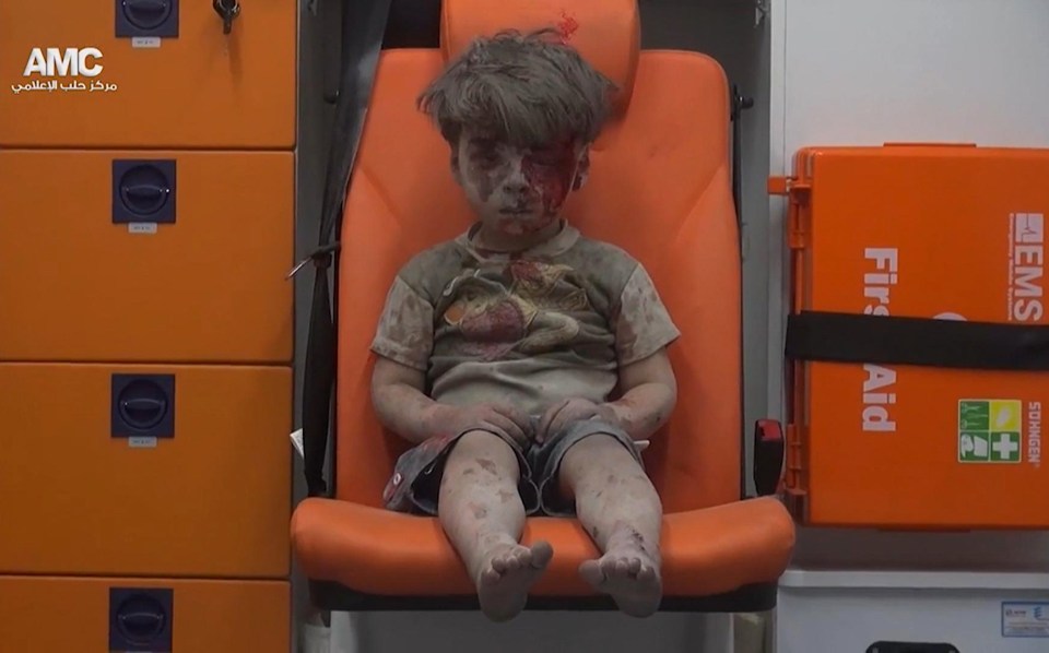  Living in hell ... five-year-old Omran's house in Aleppo was bombed by air strikes