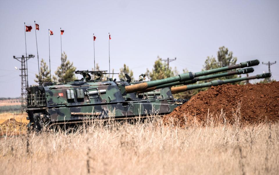 Turkish military tanks are seen during clashes between Turkish soldiers and Islamic State group fighters earlier this year