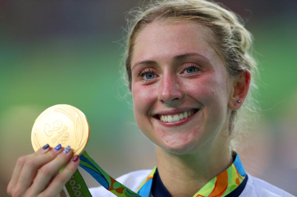  Laura Kenny holds up one of her FIVE Olympic cycling gold medals