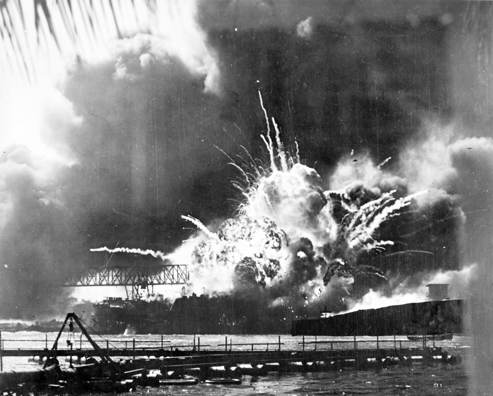 The destroyer USS Shaw explodes after being hit by Japanese bombs in the Pearl Harbor attack