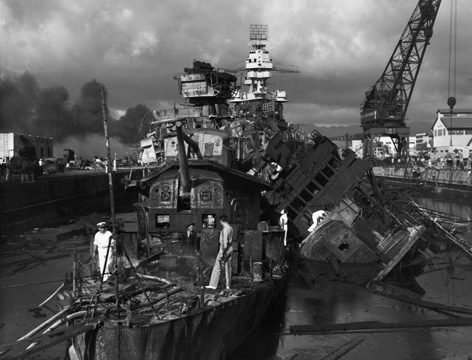 A mangled pile of metal is what was left of the USS Cassin, left, and the USS Downes, right, after the Japanese attack