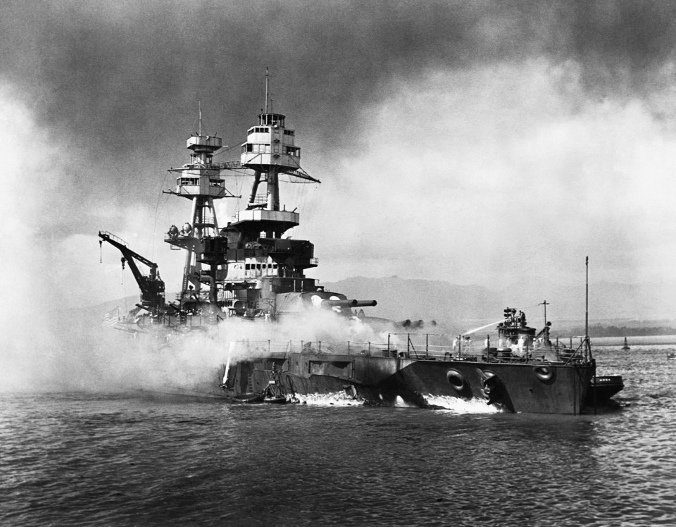 The USS Nevada burns following the surprise attack on Pearl Harbor by the Japanese military