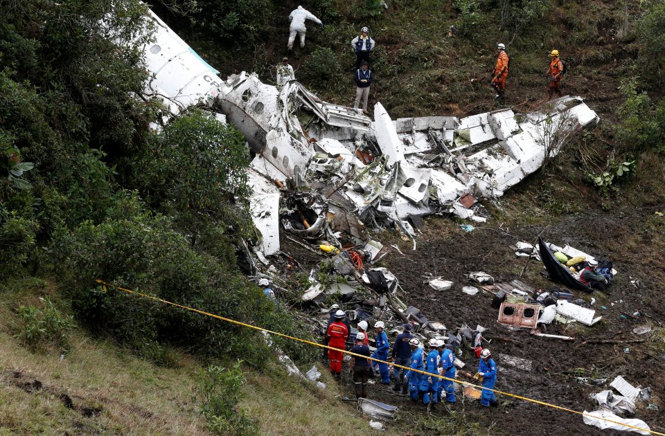 Rescue crew work at the wreckage of a plane that crashed into the Colombian jungle with Brazilian soccer team Chapecoense onboard near Medellin