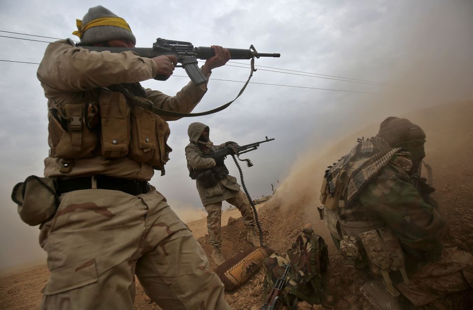  Iraqi Shiite fighters from the Hashed al-Shaabi (Popular Mobilisation) paramilitaries open fire