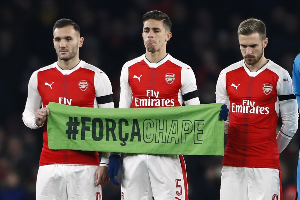 Arsenal's Gabriel Paulista (centre) broke into tears during the minute's silence at the Emirates