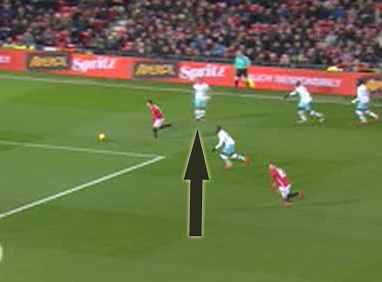 Henrikh Mkhitaryan races past Dimitri Payet after he gives away possession