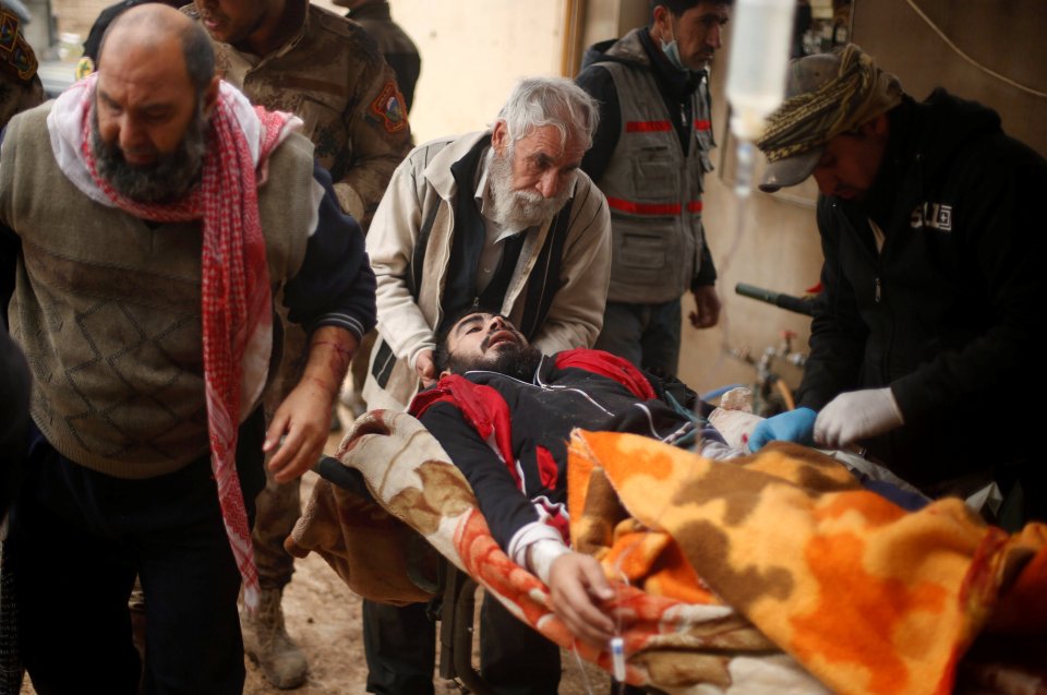  An injured civilian is rushed for treatment near Mosul