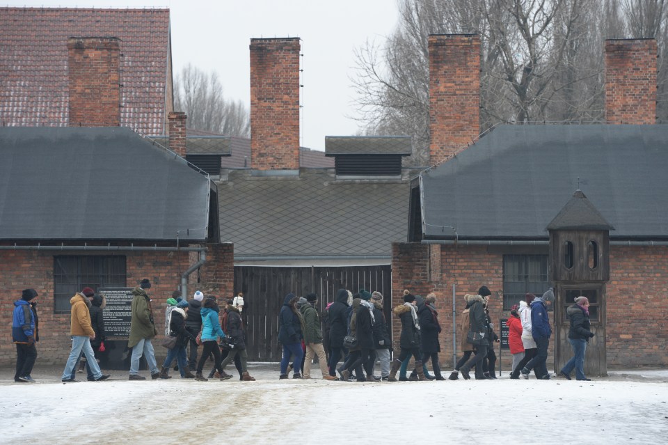 Tourists queue to visit Auschwitz in Poland