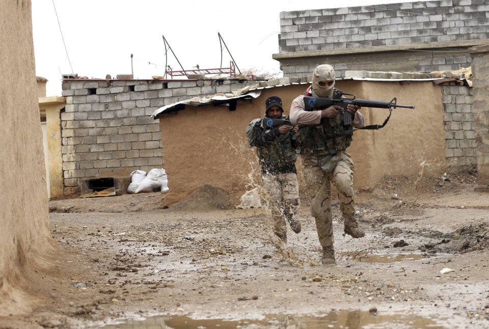  Iraqi army soldiers securing a village near Mosul ... Nearly 2,000 coalition troops were killed in November